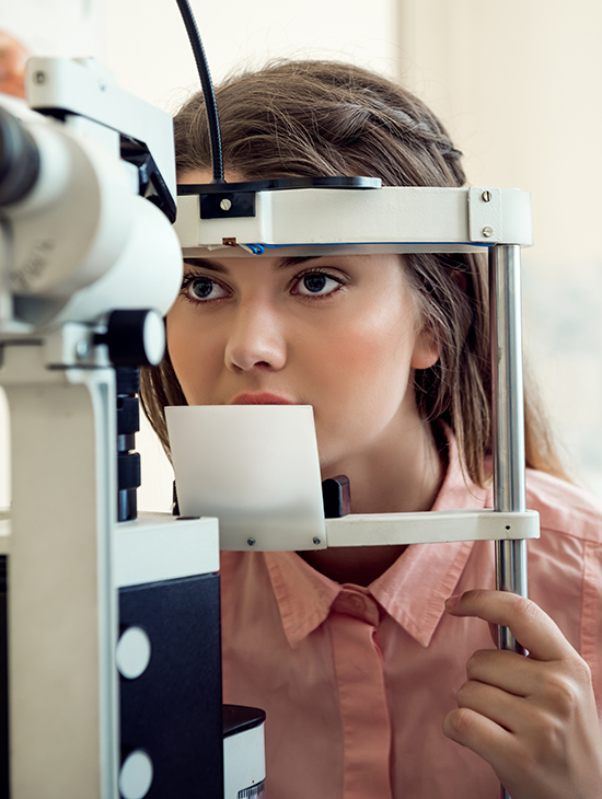 Eye specialist performing advanced eye checkup in modern ophthalmology clinic